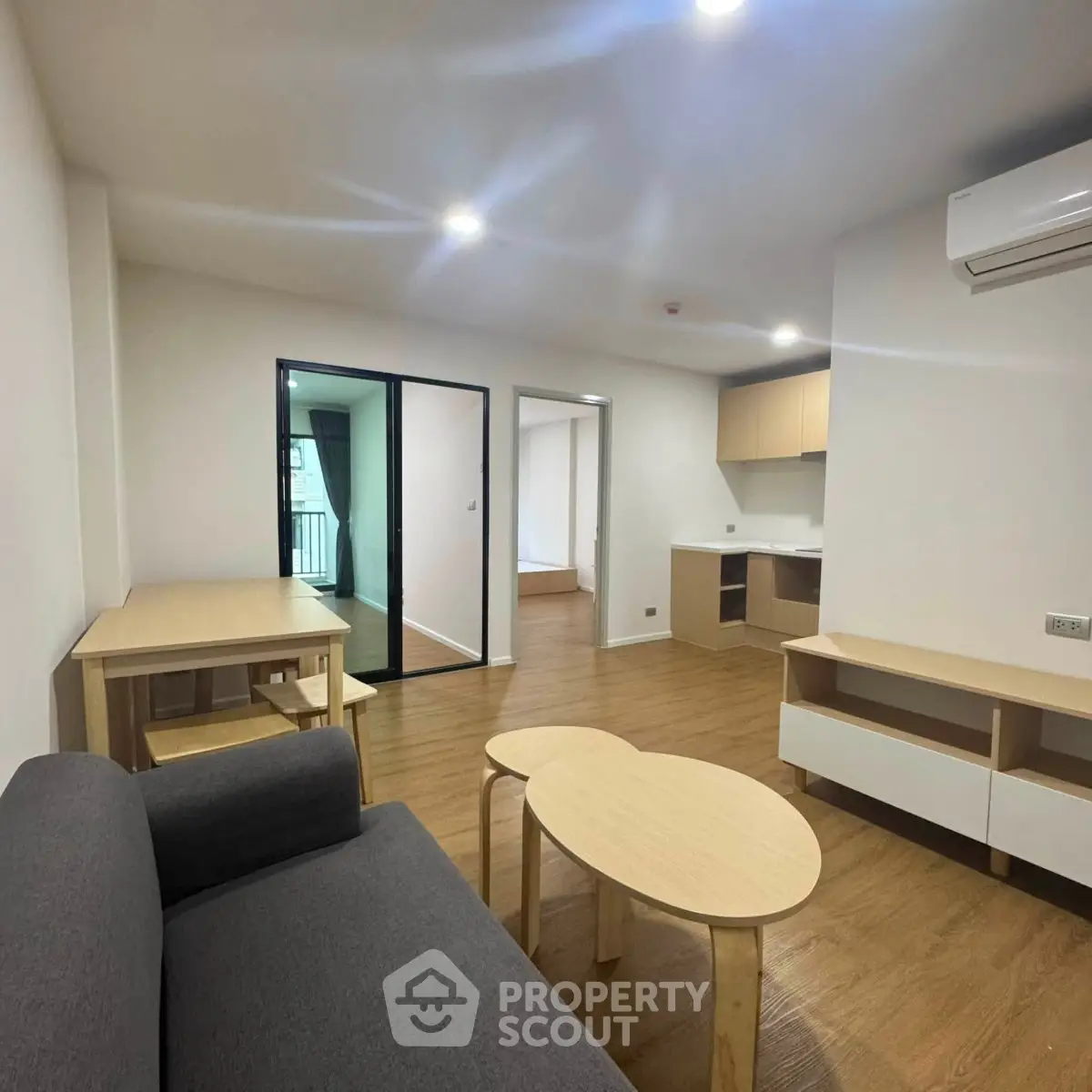 Modern living room with sleek furniture and open layout in a contemporary apartment.