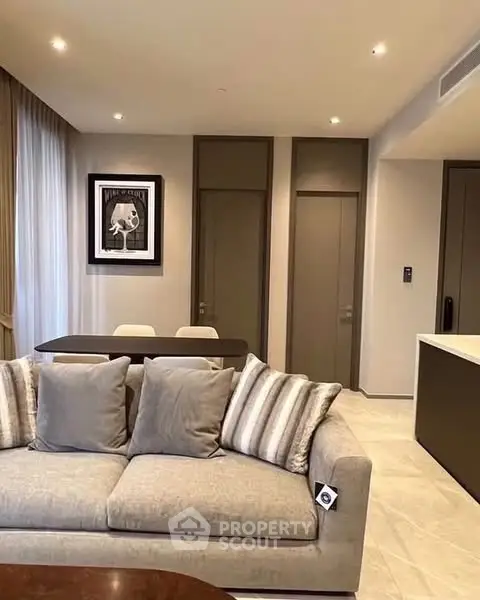 Modern living room with stylish decor and comfortable seating in a contemporary apartment.