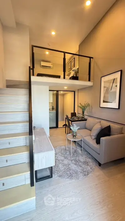 Modern loft apartment with stylish living area and mezzanine bedroom