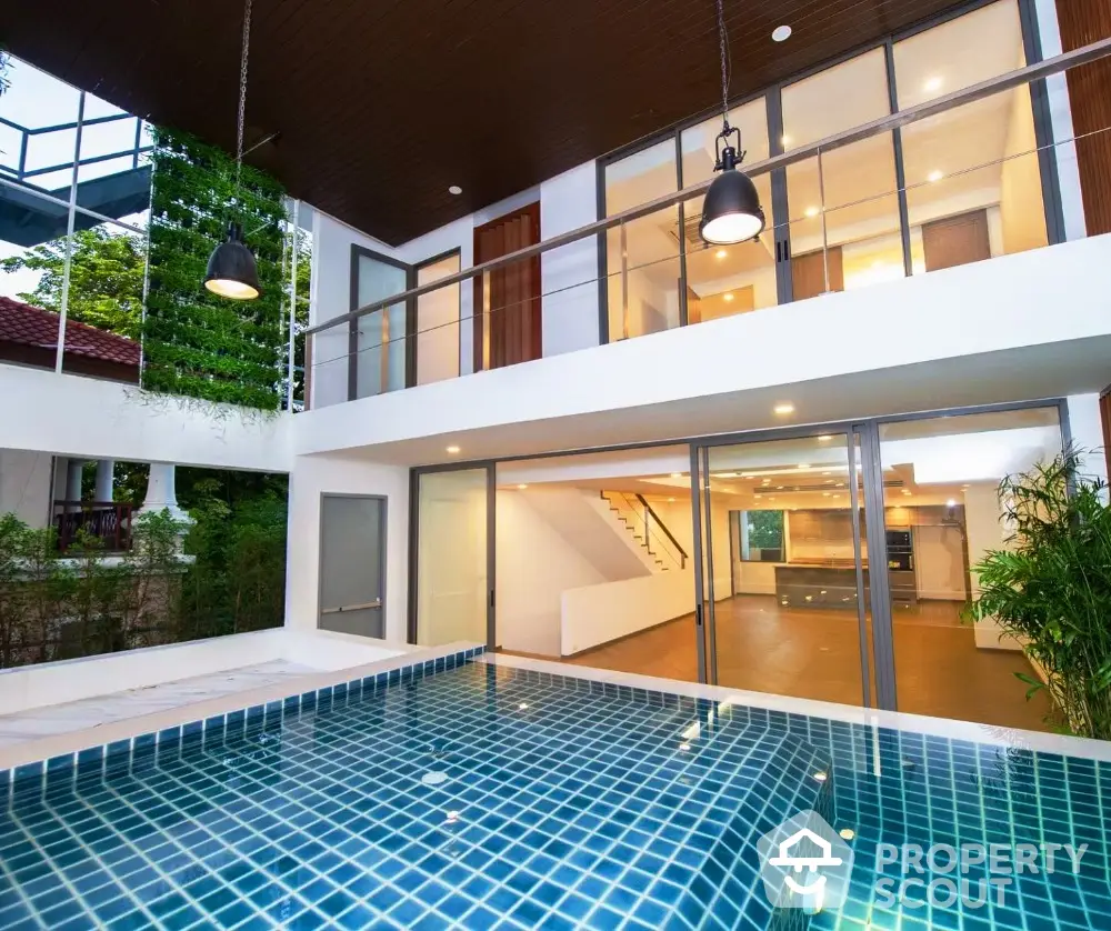 Modern luxury home with pool and spacious open-plan interior, perfect for stylish living.