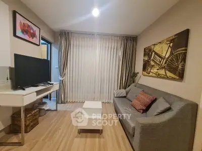 Modern living room with stylish decor and comfortable seating in a cozy apartment.