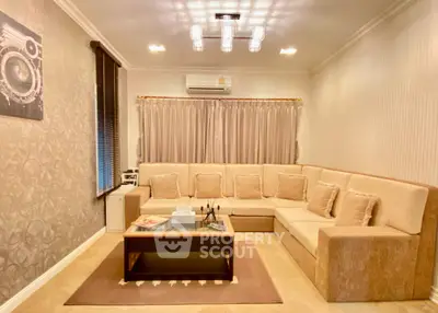 Luxurious living room with elegant beige sectional sofa and modern lighting