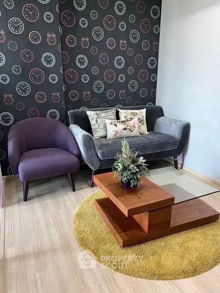 Stylish living room with modern furniture and unique clock-themed wallpaper.