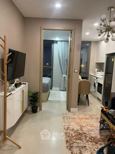 Modern apartment interior with open layout, featuring a cozy living area, stylish kitchen, and elegant bedroom.