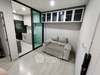 Modern compact living room with glass partition and cozy sofa