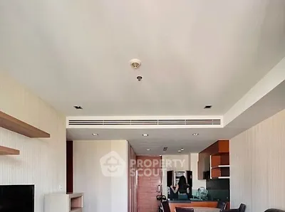 Modern open-plan living room with stylish kitchen and dining area