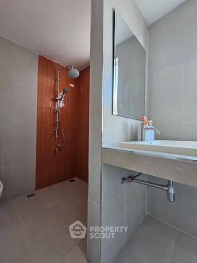 Modern bathroom with sleek shower and stylish sink area