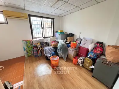 Spacious room with potential for customization, featuring wooden flooring and ample natural light.