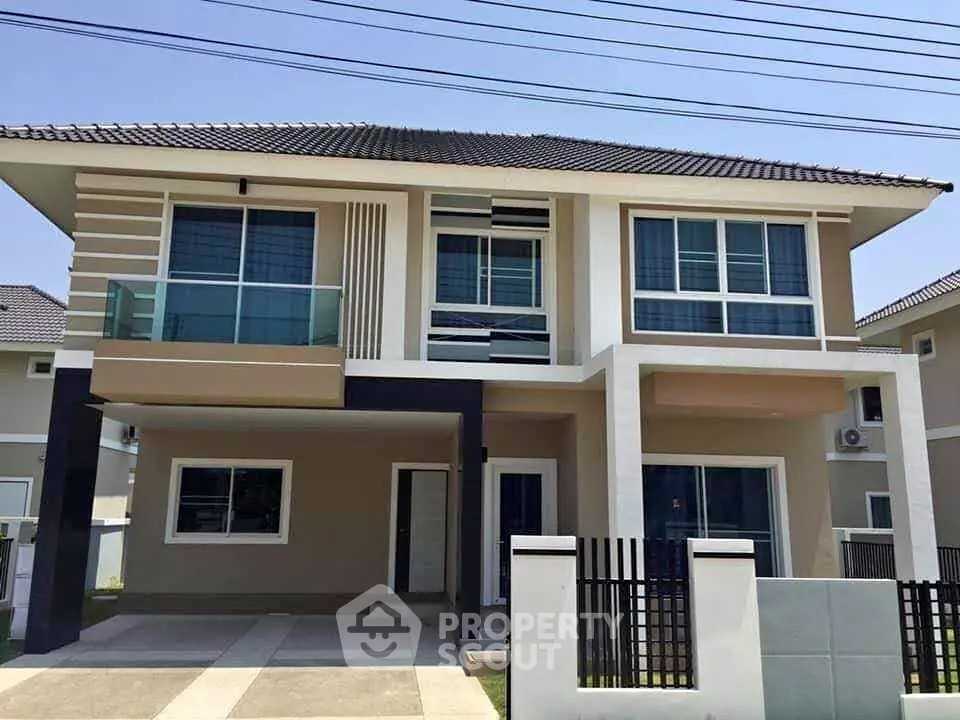 Modern two-story house with sleek design and spacious driveway