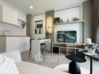 Modern living room with sleek furniture and open kitchen layout