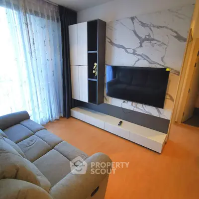 Modern living room with sleek TV setup and stylish marble accent wall