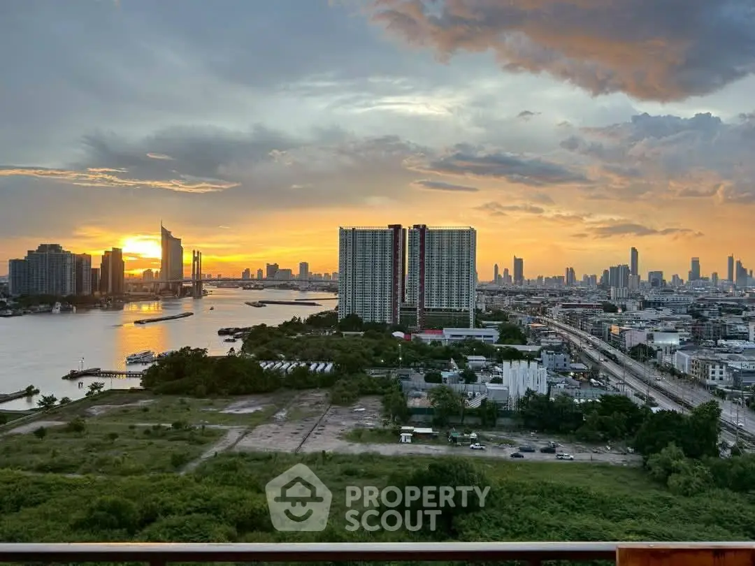 Stunning cityscape view with river and skyline at sunset, perfect for urban living enthusiasts.