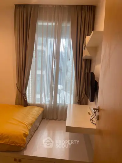 Cozy bedroom with natural light and modern decor