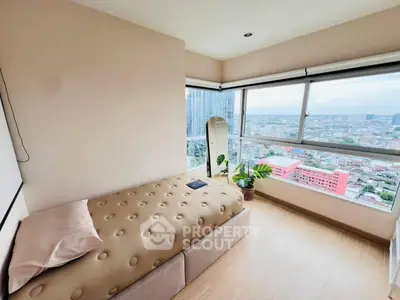 Bright bedroom with panoramic city view and modern decor