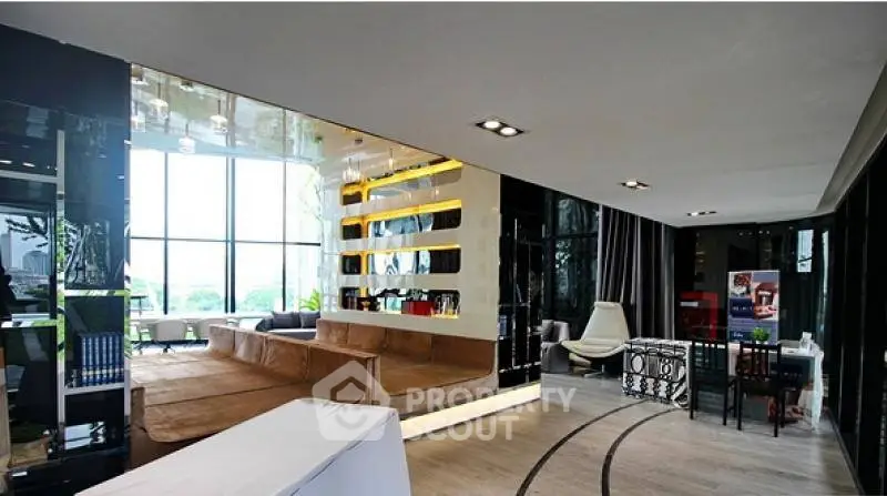 Luxurious modern living room with floor-to-ceiling windows and stylish decor