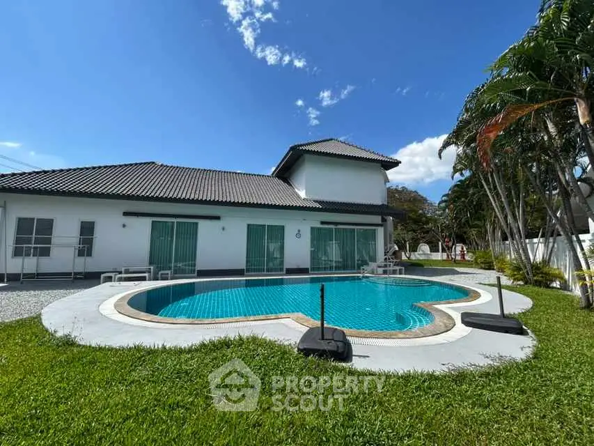 Luxurious villa with private pool and lush garden in tropical setting