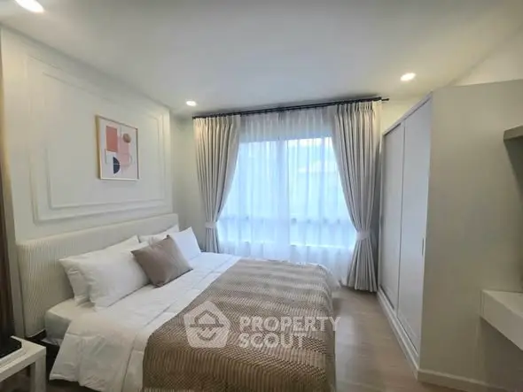 Elegant bedroom with cozy bedding and natural light