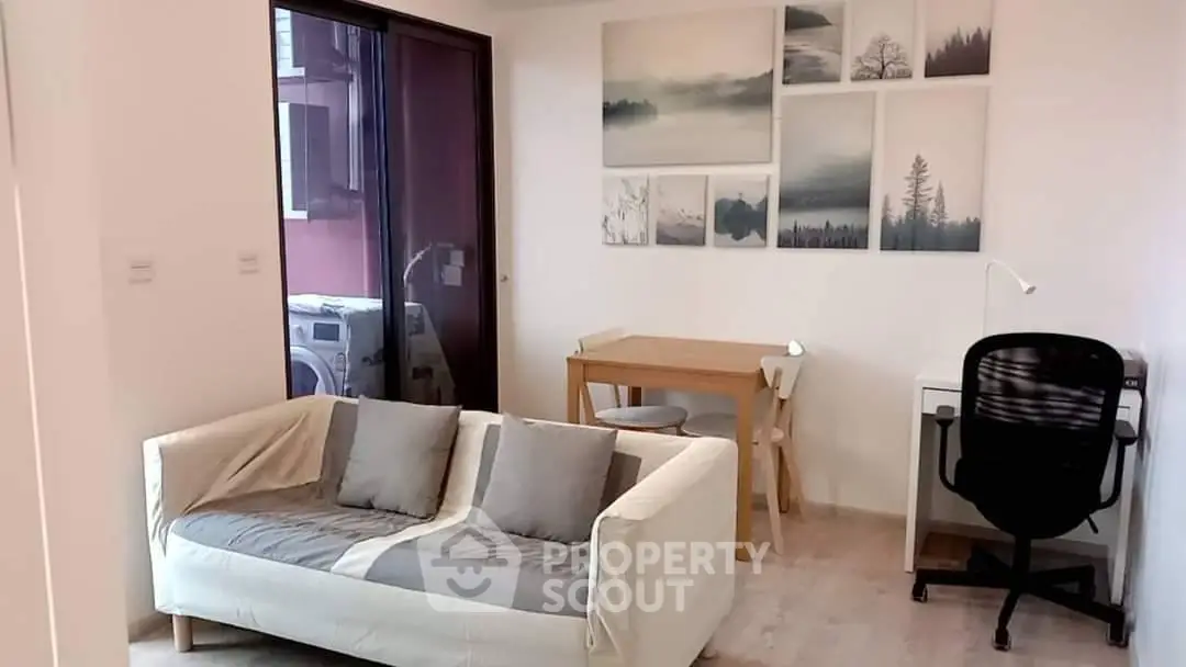 Modern living room with stylish decor and cozy seating area, perfect for relaxation and work-from-home setup.