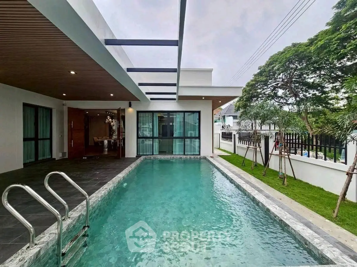 Luxurious modern home with private pool and lush garden, perfect for relaxation and entertainment.