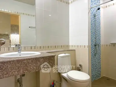 Modern bathroom with sleek fixtures and stylish tile accents