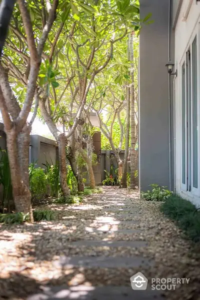 Charming garden pathway with lush greenery and serene ambiance