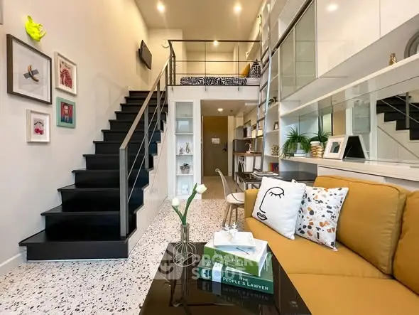 Stylish modern living room with loft, high ceilings, and chic decor