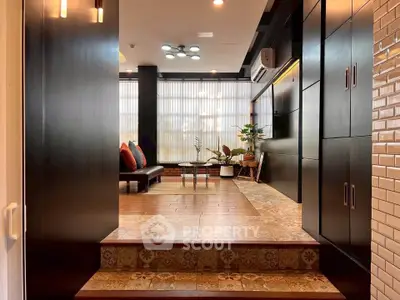 Stylish living room with modern decor and unique flooring in a contemporary home.