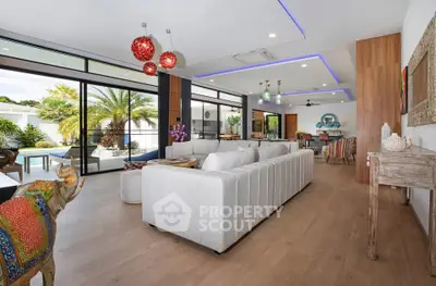 Luxurious open-plan living room with modern decor and pool view, perfect for entertaining.