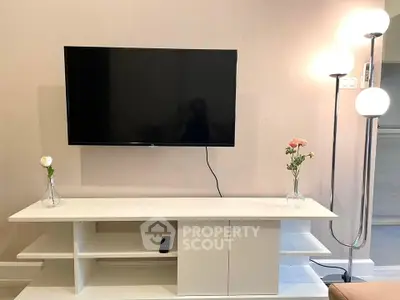 Modern living room with sleek TV setup and elegant lighting