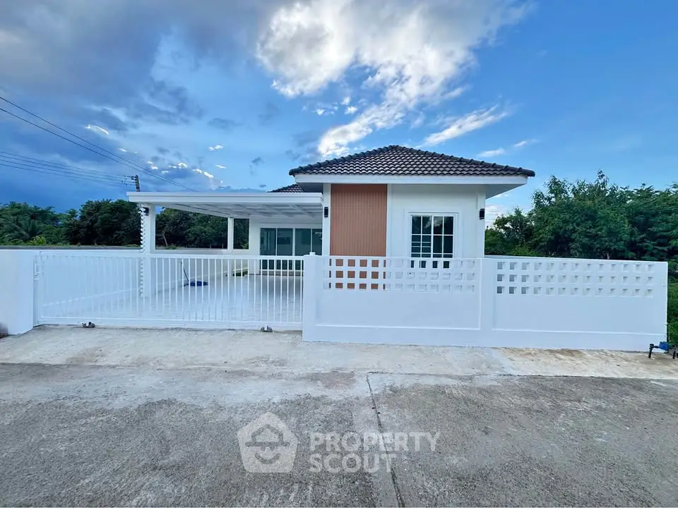 Charming single-story house with modern design and spacious driveway, perfect for family living.