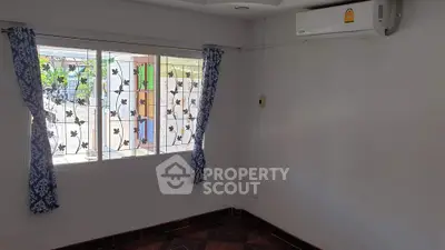 Bright room with air conditioning and decorative window curtains