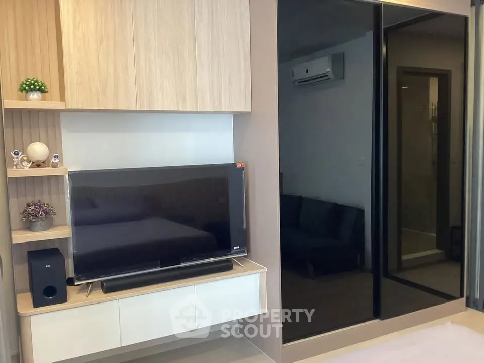 Modern living room with sleek TV setup and stylish decor