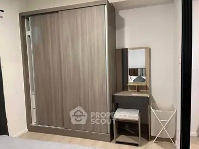 Modern bedroom with sleek wardrobe and stylish vanity set