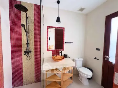 Modern bathroom with stylish red mosaic tiles and elegant fixtures