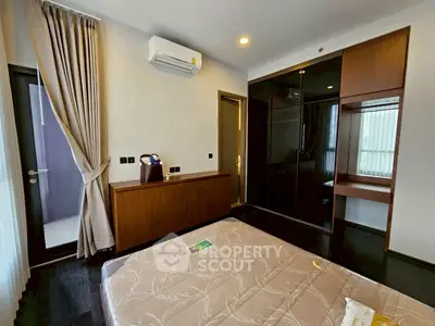 Modern bedroom with sleek design and large window for natural light