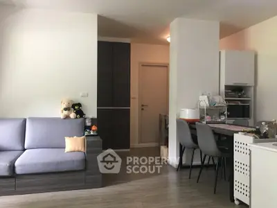 Cozy living room with modern furniture and open kitchen layout