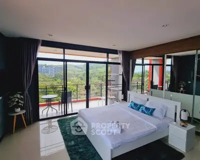 Luxurious bedroom with stunning balcony view and modern decor