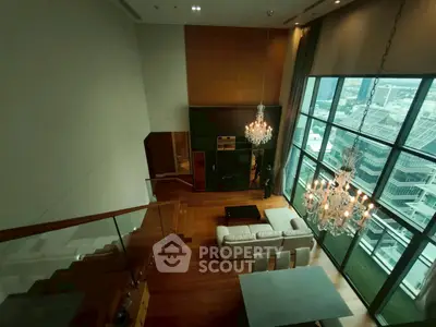 Luxurious high-rise living room with floor-to-ceiling windows and stunning city view