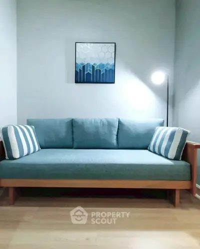 Stylish modern living room with blue sofa and elegant decor