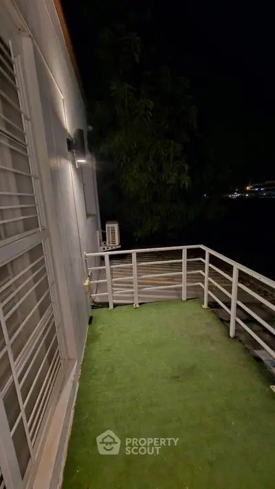 Charming balcony with night view, perfect for relaxation and enjoying the outdoors.