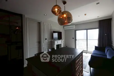 Modern living room with stylish lighting and balcony view