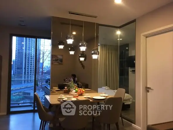 Modern dining area with city view and elegant lighting in luxury apartment