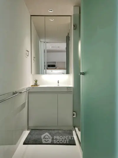 Modern minimalist bathroom with sleek fixtures and stylish lighting