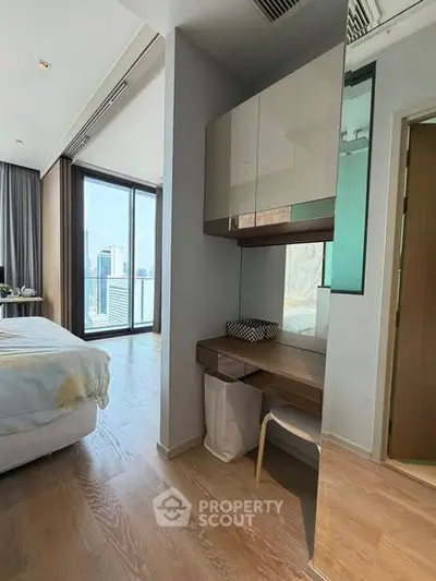 Luxurious bedroom with city view and modern furnishings in high-rise apartment