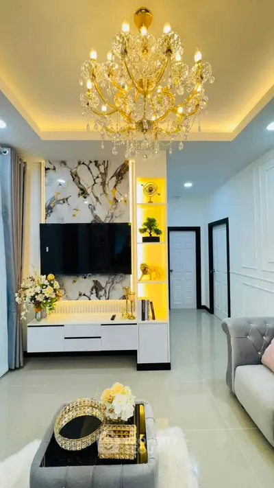 Luxurious living room with elegant chandelier and modern decor