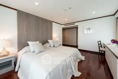 Spacious and elegant bedroom with twin beds and modern decor