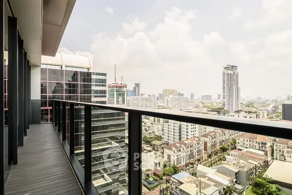 Stunning cityscape view from a modern high-rise balcony, perfect for urban living enthusiasts.