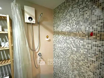 Modern bathroom with stylish mosaic tiles and sleek shower design