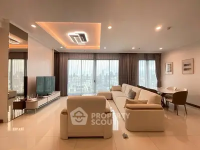 Spacious modern living room with elegant furniture and city view.