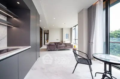 Luxurious modern living room with marble flooring and large windows offering stunning views.